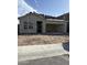 New home construction featuring a stucco facade, an incomplete roof, and an attached two-car garage at 4201 E Kolin Ln, San Tan Valley, AZ 85143