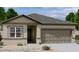 Charming single-story home featuring a symmetrical facade, a two-car garage, and low-maintenance landscaping at 4201 E Kolin Ln, San Tan Valley, AZ 85143