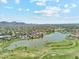 Aerial view of community featuring a golf course, lake, and desert landscape at 7401 N Scottsdale Rd # 24, Paradise Valley, AZ 85253