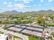 Aerial view of tennis courts in community with mountain views and desert landscape at 7401 N Scottsdale Rd # 24, Paradise Valley, AZ 85253