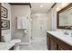 Bathroom featuring a framed glass shower, decorative mirror, and granite countertops at 7401 N Scottsdale Rd # 24, Paradise Valley, AZ 85253