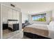 Bedroom features a large bed, mirrored closet, and scenic window view at 7401 N Scottsdale Rd # 24, Paradise Valley, AZ 85253