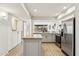 Well-lit kitchen featuring a butcher block island, stainless steel appliances, and ample storage at 7401 N Scottsdale Rd # 24, Paradise Valley, AZ 85253