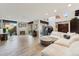 Spacious living room with fireplace, modern decor, and access to outdoor patio at 7401 N Scottsdale Rd # 24, Paradise Valley, AZ 85253