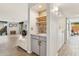 Open living space featuring a wet bar, fireplace, modern decor, and ample seating at 7401 N Scottsdale Rd # 24, Paradise Valley, AZ 85253