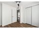 This bedroom has wood look floors, closet and is adjacent to another room viewable from the doorway at 747 W Rice Dr, Tempe, AZ 85283