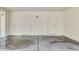 Spacious garage with white-paneled walls and concrete flooring, offering ample storage at 747 W Rice Dr, Tempe, AZ 85283