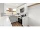 Bright kitchen featuring stainless steel appliances, white cabinets, and a window view at 747 W Rice Dr, Tempe, AZ 85283