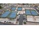 Aerial view showcases community tennis, shuffleboard, and putting green amenities at 8011 E Milagro Ave, Mesa, AZ 85209