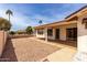 Low-maintenance backyard with a covered patio and gravel landscaping at 8011 E Milagro Ave, Mesa, AZ 85209