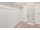 Walk-in closet featuring built-in shelving and carpeted floors at 8011 E Milagro Ave, Mesa, AZ 85209