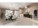 Elegant dining room featuring a chandelier, stylish chairs, and a decorative rug at 8011 E Milagro Ave, Mesa, AZ 85209