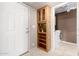 Practical entryway with tile flooring, a coat closet, and access to the laundry room at 8011 E Milagro Ave, Mesa, AZ 85209