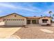 Charming single-story home with a two-car garage and well-maintained desert landscaping at 8011 E Milagro Ave, Mesa, AZ 85209