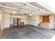 Spacious garage includes built-in storage cabinets and ample room for parking and projects at 8011 E Milagro Ave, Mesa, AZ 85209