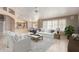 Stylishly furnished living room with plush seating, neutral tones, and ample natural light at 8011 E Milagro Ave, Mesa, AZ 85209