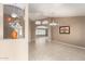 Spacious living room featuring neutral walls, tile flooring, and decorative art niches at 8011 E Milagro Ave, Mesa, AZ 85209