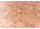 Textured tile patio floor offers unique texture and color for outdoor living at 8011 E Milagro Ave, Mesa, AZ 85209