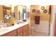Bathroom with dual sinks, ample counter space, and a well-lit vanity, providing a functional and stylish space at 8020 E Keats Ave # 279, Mesa, AZ 85209