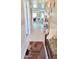Bright hallway featuring neutral walls, decorative accents, and tiled floors leading to multiple living spaces at 8020 E Keats Ave # 279, Mesa, AZ 85209