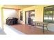 Covered patio with tile flooring, table, and grill, perfect for enjoying outdoor dining and relaxing at 8020 E Keats Ave # 279, Mesa, AZ 85209