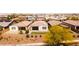 An elevated view highlights the property's lush landscaping, enhancing its curb appeal and charm at 9229 W Willow Bend Ln, Phoenix, AZ 85037