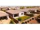 An aerial view reveals a beautifully landscaped backyard, fenced-in for privacy and security at 9229 W Willow Bend Ln, Phoenix, AZ 85037