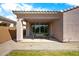 Covered back patio with sliding glass doors offers seamless indoor/outdoor living space at 9229 W Willow Bend Ln, Phoenix, AZ 85037