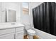 Well lit bathroom featuring a shower tub and modern sink and cabinet at 9229 W Willow Bend Ln, Phoenix, AZ 85037