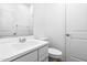Bathroom features vanity with white cabinet, single sink, and standard toilet at 9229 W Willow Bend Ln, Phoenix, AZ 85037