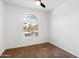 Bright bedroom featuring a large arch window and neutral carpeting at 9229 W Willow Bend Ln, Phoenix, AZ 85037