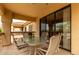 Outdoor patio with table and chairs offering relaxing place to dine al fresco at 9253 N Firebrick Dr # 206, Fountain Hills, AZ 85268