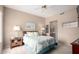 Serene bedroom featuring a comfortable queen-sized bed, soft lighting, and access to an en-suite bathroom at 9253 N Firebrick Dr # 206, Fountain Hills, AZ 85268