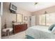 Inviting bedroom with dresser, mirror, and a window providing natural light, complemented by cozy decor at 9253 N Firebrick Dr # 206, Fountain Hills, AZ 85268