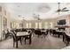 Bright dining hall boasts ample seating, a cozy fireplace, and a large-screen TV for community gatherings at 9253 N Firebrick Dr # 206, Fountain Hills, AZ 85268