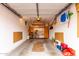 Two-car garage with storage shelves and plenty of room for vehicles and equipment at 9253 N Firebrick Dr # 206, Fountain Hills, AZ 85268