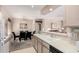 Open kitchen with view into dining and living areas, featuring functional layout and bright countertops at 9253 N Firebrick Dr # 206, Fountain Hills, AZ 85268