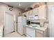Functional kitchen layout with white appliances and cabinetry, complemented by a clean and bright aesthetic at 9253 N Firebrick Dr # 206, Fountain Hills, AZ 85268