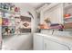 Functional laundry room with washer, dryer, and ample shelving for storage at 9253 N Firebrick Dr # 206, Fountain Hills, AZ 85268