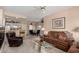Open floor plan with living room flowing into dining area, featuring neutral tones and comfortable furnishings at 9253 N Firebrick Dr # 206, Fountain Hills, AZ 85268