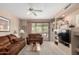 Relaxing living room with plush seating, built-in shelves, and sliding glass doors offering natural light at 9253 N Firebrick Dr # 206, Fountain Hills, AZ 85268