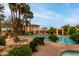 Relaxing community pool with lounge chairs, manicured landscaping, and palm trees at 9253 N Firebrick Dr # 206, Fountain Hills, AZ 85268