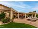 Community pool with chairs and shaded dining areas at 9253 N Firebrick Dr # 206, Fountain Hills, AZ 85268