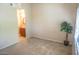 Bright bedroom with neutral carpet, view into ensuite bathroom and ample closet space at 930 N Mesa Dr # 2027, Mesa, AZ 85201