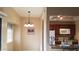 Adjacent dining area featuring modern lighting and views into the kitchen and bar seating at 930 N Mesa Dr # 2027, Mesa, AZ 85201