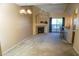 Spacious living room with a fireplace, breakfast bar, and sliding glass door to patio at 930 N Mesa Dr # 2027, Mesa, AZ 85201