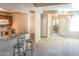 Open concept living area integrates the kitchen and dining spaces with abundant natural light at 930 N Mesa Dr # 2027, Mesa, AZ 85201