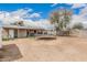 Expansive backyard with a trampoline and covered patio at 10723 N 80Th Ln, Peoria, AZ 85345