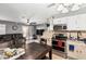 Open-concept kitchen and living space featuring tile flooring and stainless steel appliances at 10723 N 80Th Ln, Peoria, AZ 85345