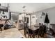 Open concept eat-in kitchen with stainless appliances and tile flooring at 10723 N 80Th Ln, Peoria, AZ 85345